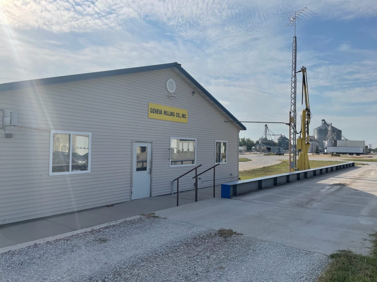 A building with a crane in the background.